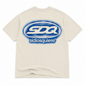 Si Dios Quiere Badge T-Shirt
